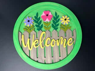WELCOME WOODEN SIGN- FLOWERS WITH FENCE 14"